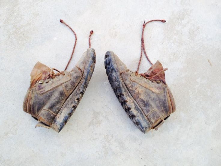 My Courtney boots from Zimbabwe, now ten years old, two of which have been spent as gardening boots. I dropped them on the concrete after gardening one day, and this is how they landed.